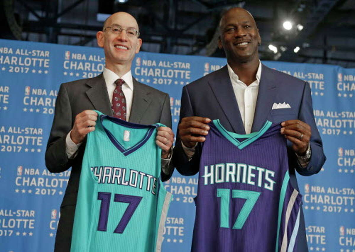 FILE - In this June 23, 2015, file photo, NBA commissioner Adam Silver, left, and Charlotte Hornets owner Michael Jordan, right, pose for a photo during a news conference to announce Charlotte, N.C., as the site of the 2017 NBA All-Star basketball game. Silver said Thursday, April 21, 2016, he believes the league has made it "crystal clear" that a change in a North Carolina law that limits anti-discrimination protections for lesbian, gay and transgender people is necessary to stage the 2017 All-Star Game in Charlotte, though is resisting setting a deadline for a decision. (AP Photo/Chuck Burton, File)