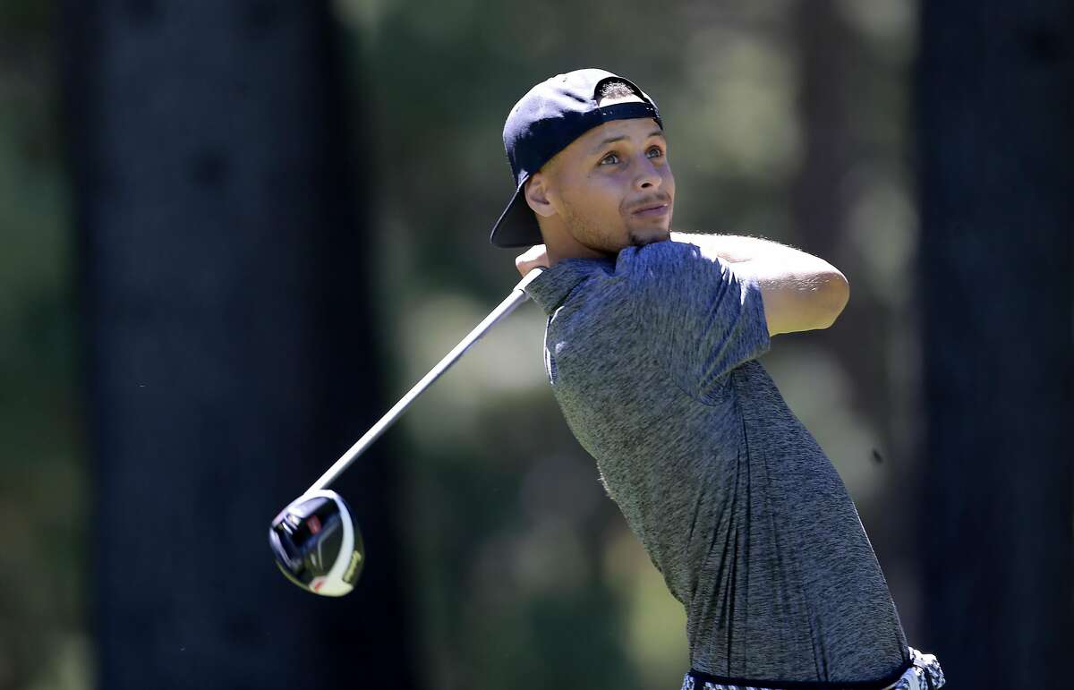 FILE PHOTO: Golden State Warriors' Stephen Curry watches his tee shot on the 13th hole during the 2016 American Century Celebrity-Amateur Tournament in Lake Tahoe, Nevada, California, on Thurs. July 22, 2016.