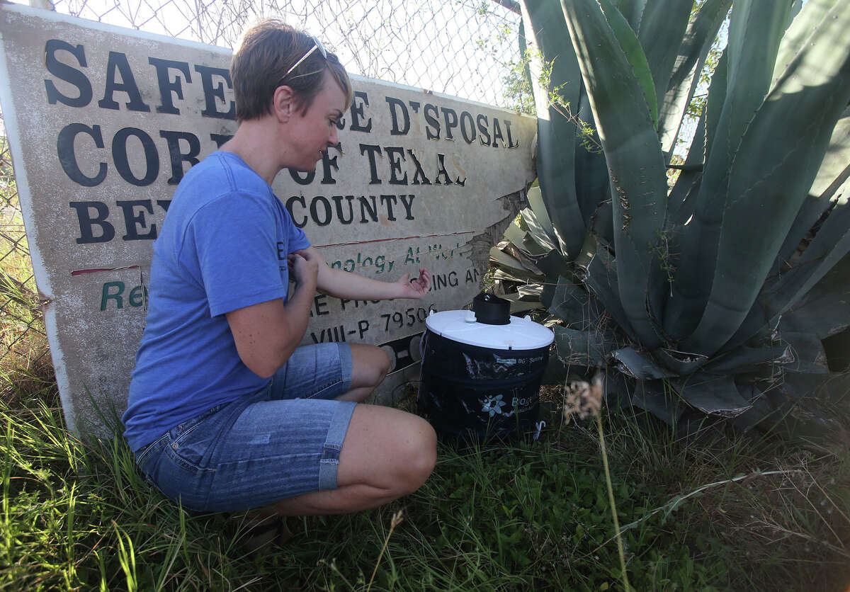 Texas A&M University-San Antonio associate professor of biology Megan Wise de Valdez checks a mosquito trap July 19, 2016, in front of the former Safe Tire Disposal Corp. tire storage facility, 11150 Applewhite Road on the city's South Side. A mosquito researcher, Wise de Valdez has been checking traps to see if the types of mosquitos breeding there can spread diseases such as Zika virus.