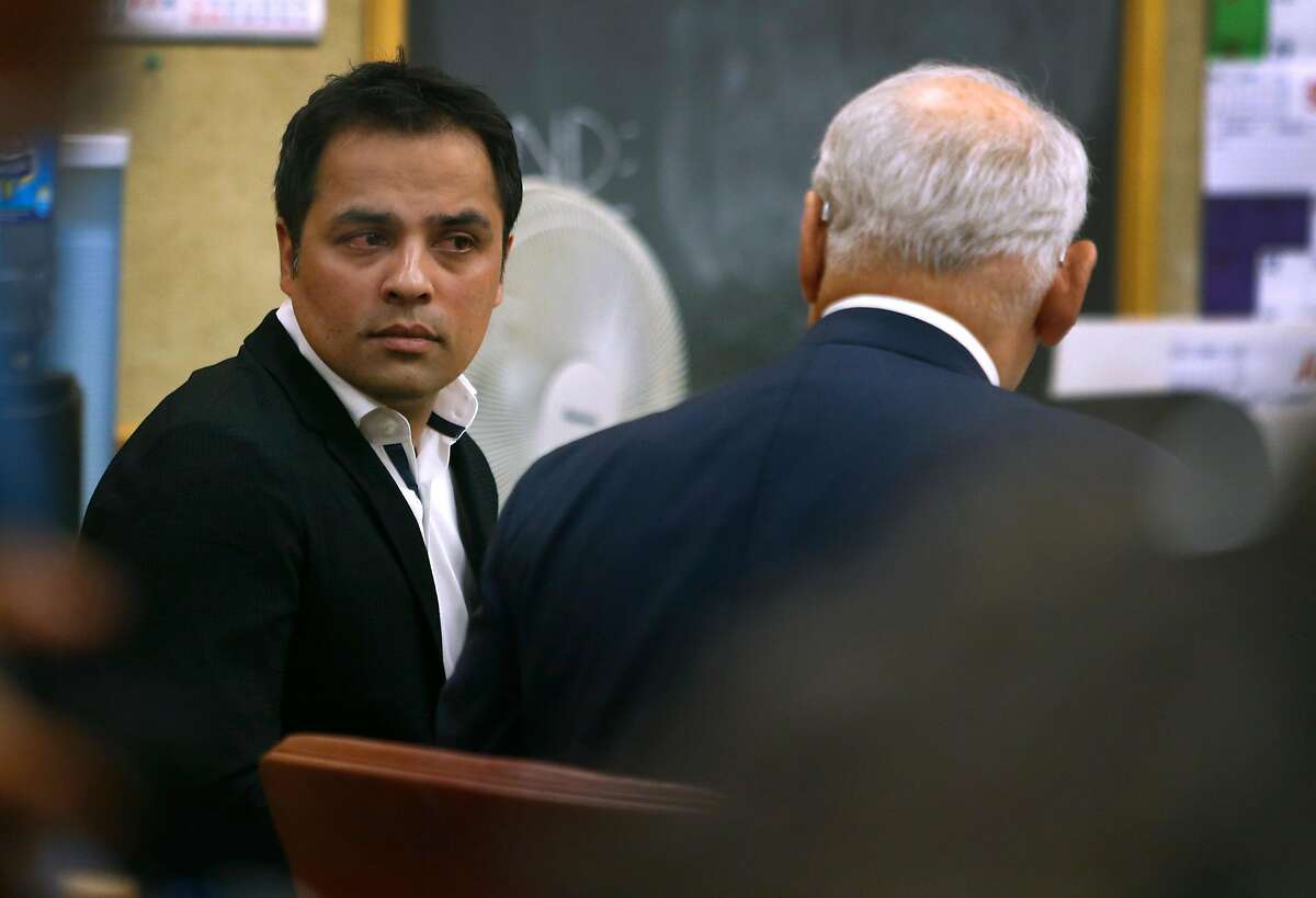 Tech mogul Gurbaksh Chahal speaks with his attorney James Lassart during a hearing to consider revocation of his probation on domestic violence charges in San Francisco, Calif. on Friday, July 22, 2016.