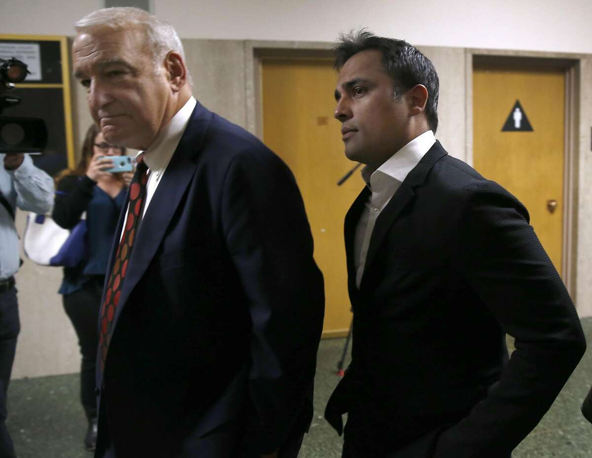 Attorney James Lassart escorts his client, tech mogul Gurbaksh Chahal, into a courtroom at the Hall of Justice for a hearing to consider revocation of his probation on domestic violence charges in San Francisco, Calif. on Friday, July 22, 2016.