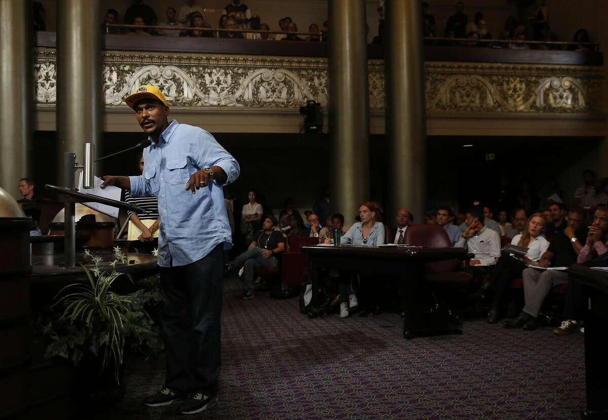 Anthony Limbrick asks a question about how born and raised Oakland residents and aspiring business owners can receive help during an informational meeting hosted by the Cannabis Regulatory Commission in the City Council Chambers in City Hall July 21, 2016 in Oakland, Calif.