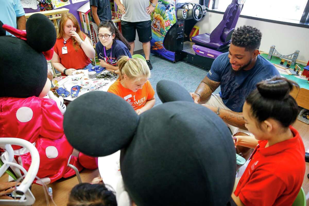 Houston Texans defensive end Devon Still, right, visits kids with cancer at the Texas Children's Hospital Friday, July 22, 2016. Still's daughter, Leah Still, was diagnosed with neuroblastoma in 2014 and just beat the rare form of cancer earlier this year. Still and Leah created the Still Strong Foundation to provide financial support to families with children battling cancer.