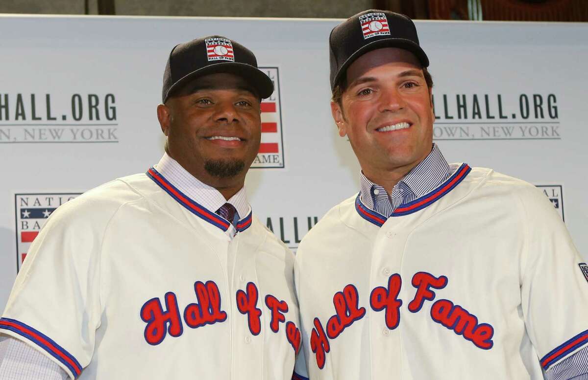 FILE - In this Jan. 7, 2016, file photo, Ken Griffey Jr., left, poses for a photograph with Mike Piazza at a press conference announcing they are both elected into the 2016 National Baseball Hall of Fame, in New York. The Seattle Mariners made Ken Griffey Jr. the first pick of the 1987 amateur draft and a year later the Dodgers selected Mike Piazza on the 62nd round with the 1,390th pick. Both left indelible imprints on the game and will be rewarded Sunday with induction into the Baseball Hall of Fame. (AP Photo/Kathy Willens, File) ORG XMIT: NY160