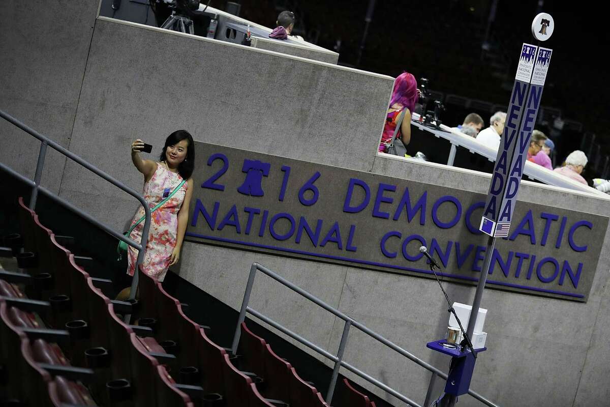 Winnie Wang takes a selfie at the Wells Fargo Center before the start of the Democratic National Convention, which runs Monday through Thursday.