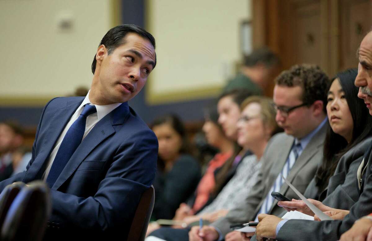 House and Urban Development Secretary Julian Castro looks over his shoulder to consult members of his staff while testifying on Capitol Hill in Washington, Wednesday, July 13, 2016, before the House Financial Services Committee on the changes to the Distressed Asset Stabilization Program. (AP Photo/Pablo Martinez Monsivais)