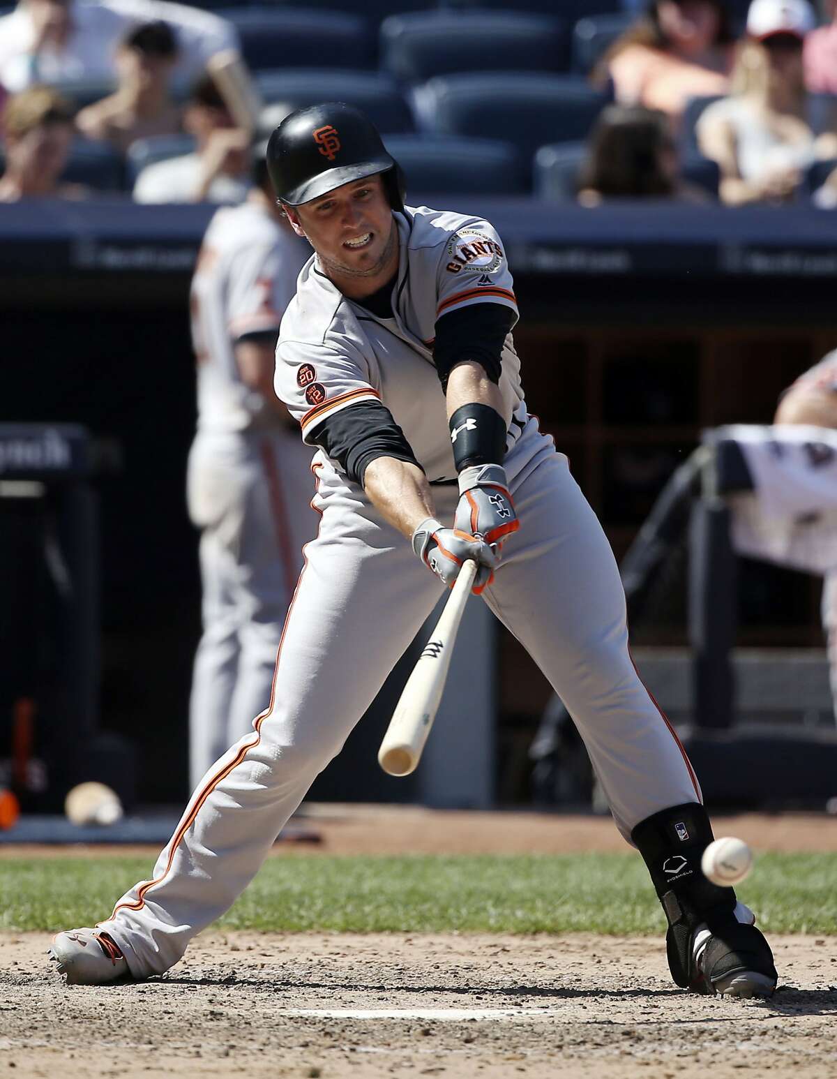 San Francisco Giants' Buster Posey hits a two-run single during the seventh inning of a baseball game against the New York Yankees at Yankee Stadium, Sunday, July 24, 2016, in New York. (AP Photo/Seth Wenig)