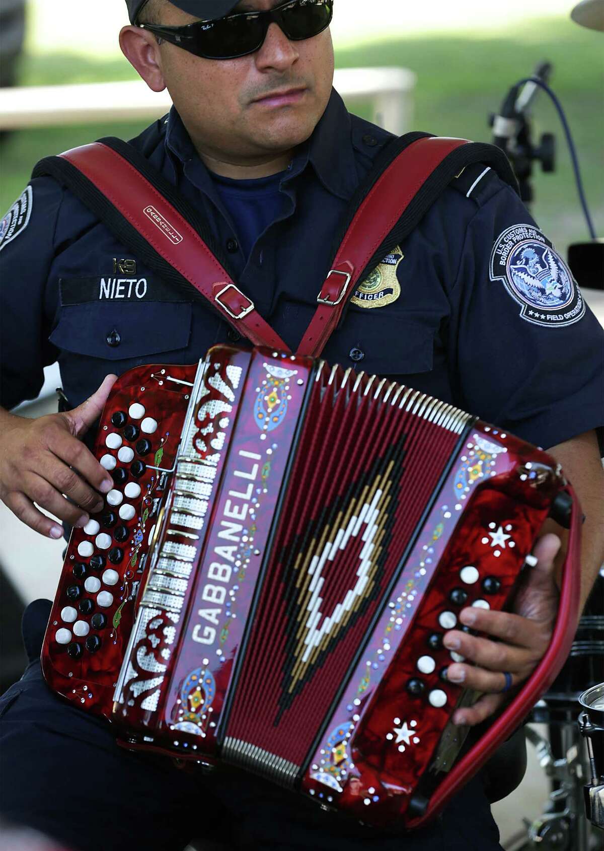 Javier Nieto plays his accordion withThe U.S. Customs and Border Protection band knows as Los Federales. They played at a CBP community outreach event at Bonita Park near Rio Grande City, on Wednesday, May 4, 2016.