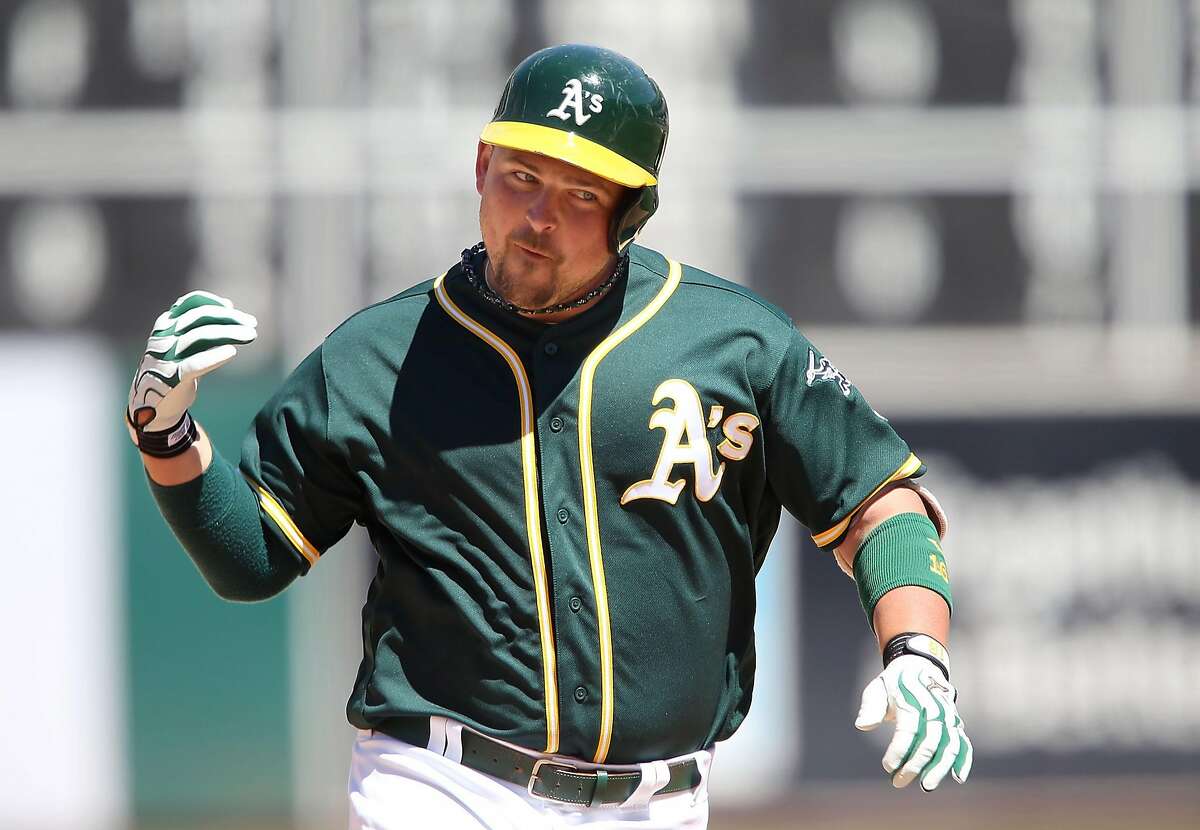 OAKLAND, CA - JULY 24: Billy Butler #16 of the Oakland Athletics celebrates a solo homerun in the bottom of the eighth inning to regain the lead against the Tampa Bay Rays at the Oakland-Alameda Coliseum on July 24, 2016 in Oakland, California. (Photo by Don Feria/Getty Images)