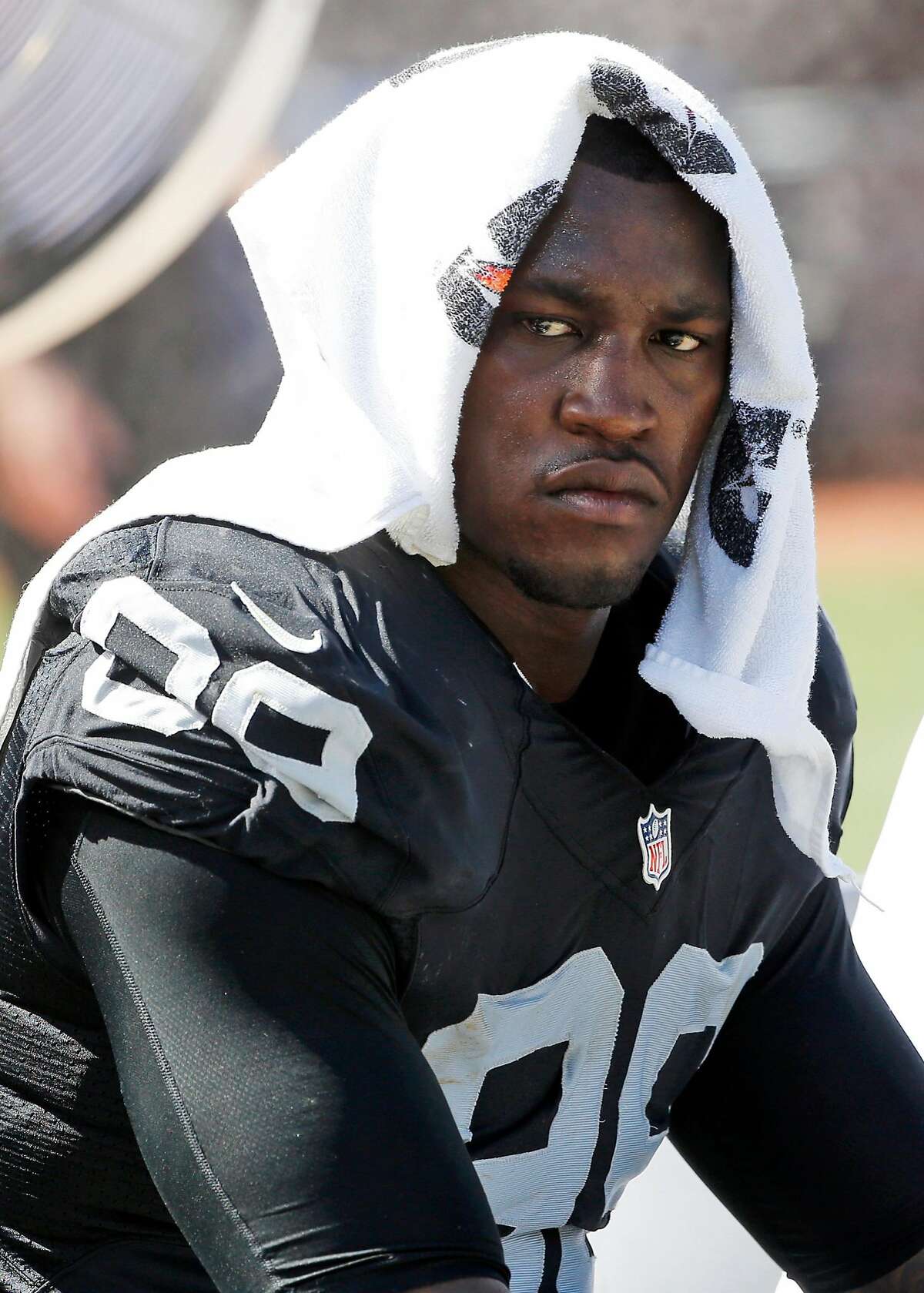 FILE - In this Sept. 20, 2015, file photo, Oakland Raiders defensive end Aldon Smith (99) cools off during an NFL football game against the Baltimore Ravens in Oakland , Calif. Every year, there are blue chippers carrying red flags. This season, the marketplace has Richie Incognito, Greg Hardy, Aldon Smith, Adam Jones, Andre Smith, Nick Fairley, Percy Harvin and Junior Galette. Lots of talent there, but plenty of locker room and off-field concerns, too. (AP Photo/Tony Avelar, File)