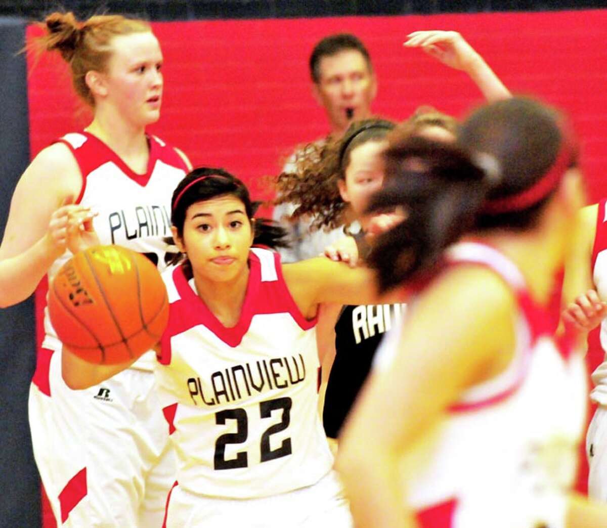Plainview Lady Bulldog Michelle Portillo (22) looks down the floor as she anticipates passing to a teammate during a game last week against Randall. The No. 19 Lady Dogs take on No. 5 Canyon at 6 p.m. today in Canyon, before the Bulldogs meet the Eagles at 7:30. The games can be heard on KKYN (106.9 FM.)