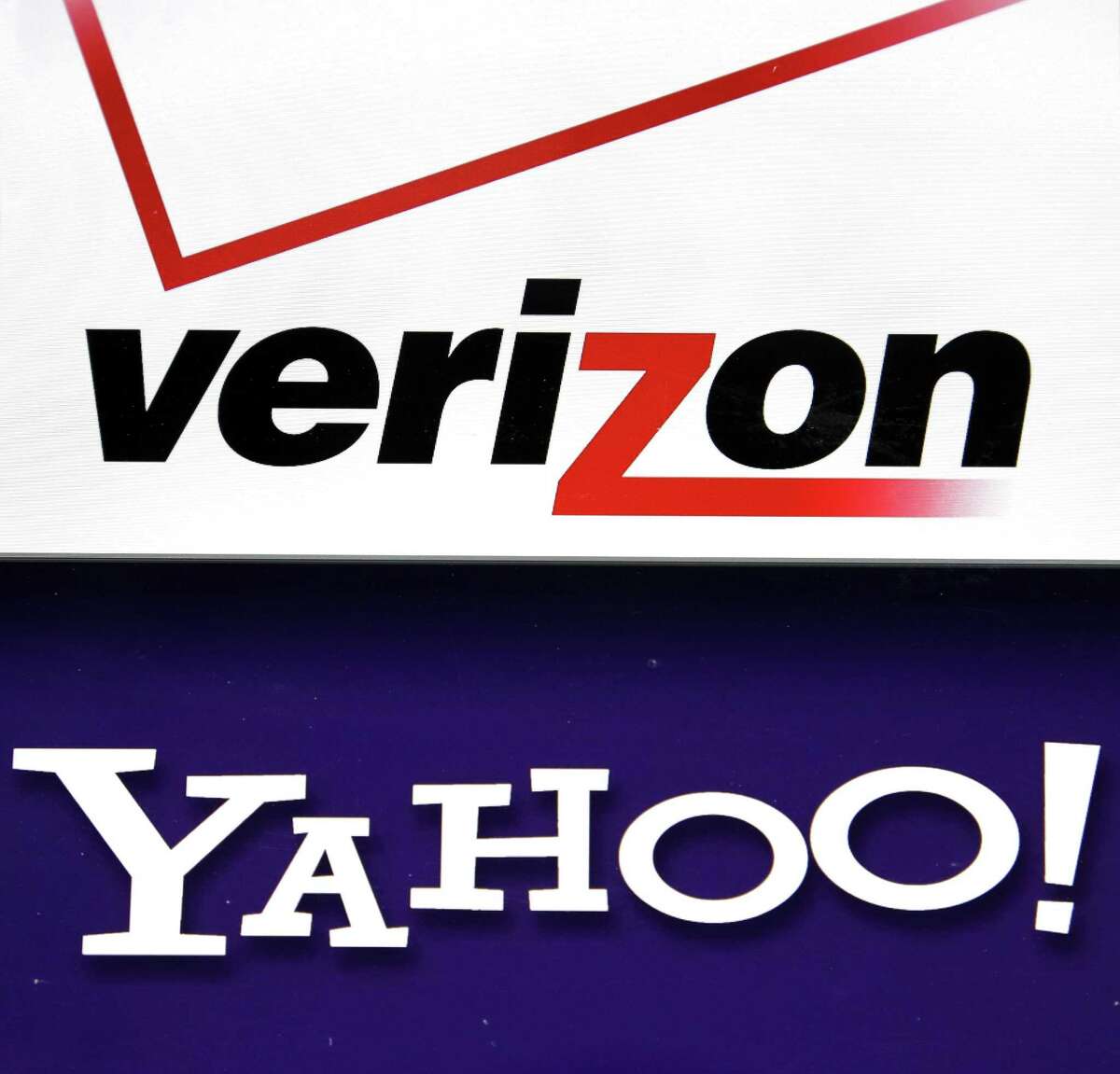 Verizon Communications Inc. is getting close to a renegotiated deal for Yahoo Inc.’s internet properties that would reduce the price of the original $4.8 billion deal by about $250 million, according to people familiar with the matter. Their logos are shown on a laptop.