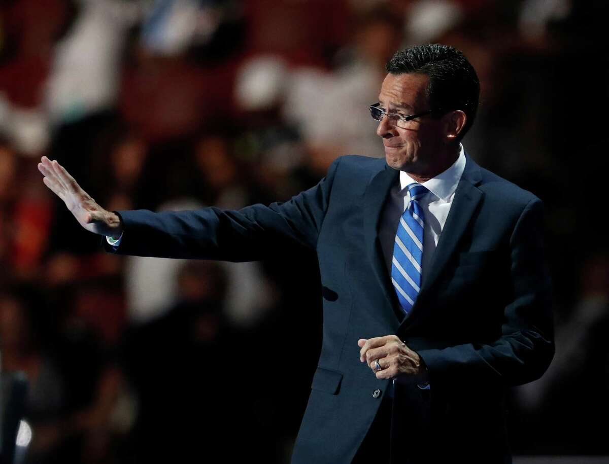 Gov. Dannel Malloy, D-Conn., waves as he walks on stage to address delegates during the first day of the Democratic National Convention in Philadelphia , Monday, July 25, 2016.