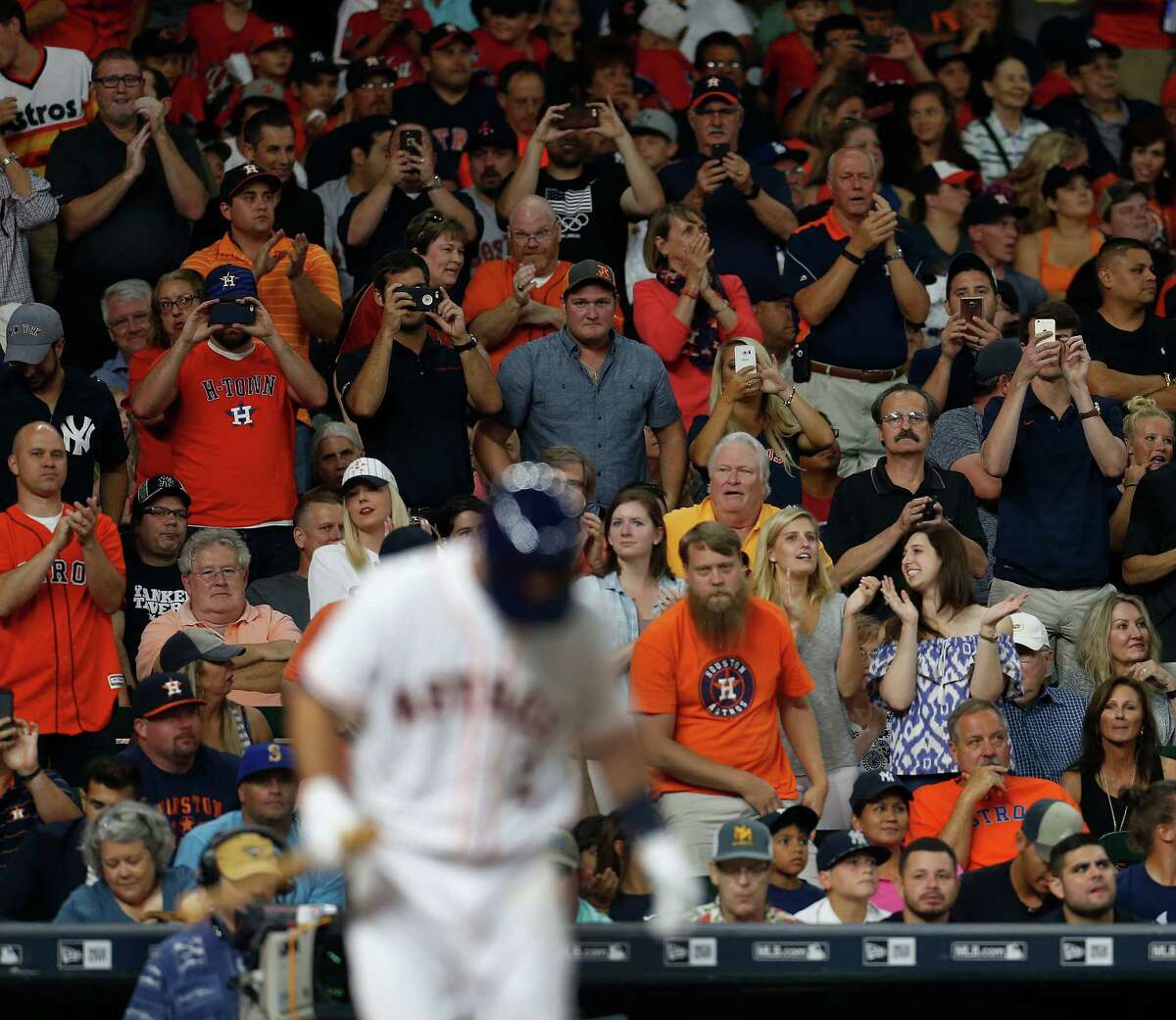 Fans stand and cheer as Houston Astros third baseman Alex Bregman (2) takes his first Major League at bat during the second inning of an MLB game at Minute Maid Park, Monday, July 25, 2016, in Houston.