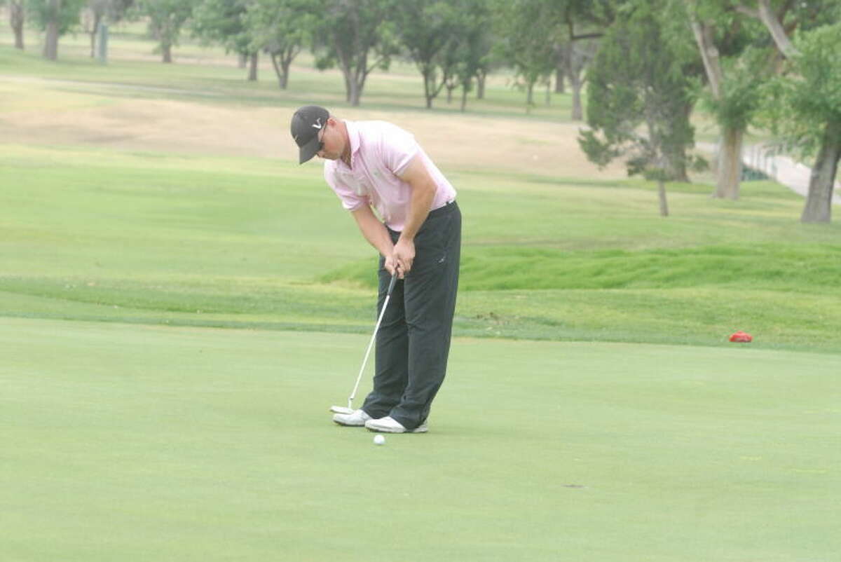Chris McAlister sinks a 6-foot putt on No. 2 to win the Jack Williams Invitational championship in a sudden death playoff at Plainview Country Club Monday morning.