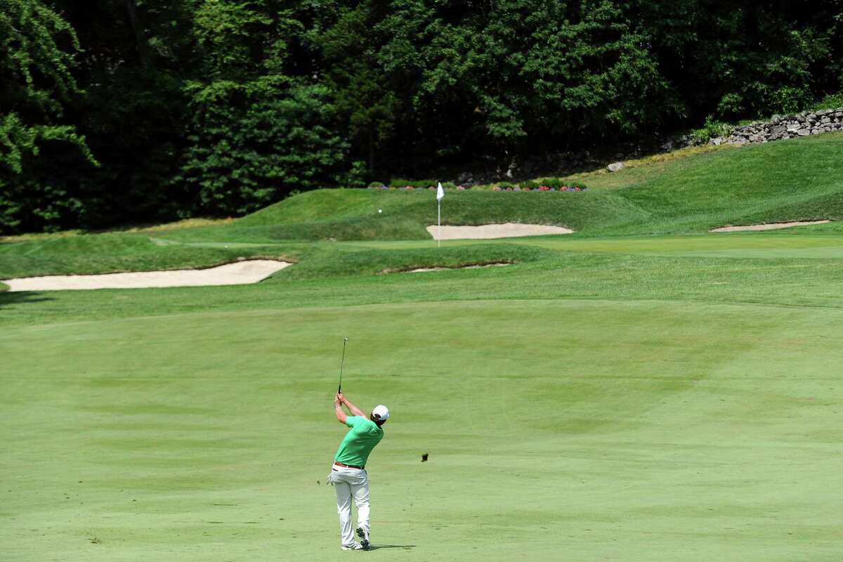 Oren Shake, of the H. Smith Richardshon Golf Club in Fairfield, Conn., hits a shot from the fairway during day 1 of the Connecticut Open at the Woodway Country Club in Darien, Conn. on Monday, July 25, 2016.