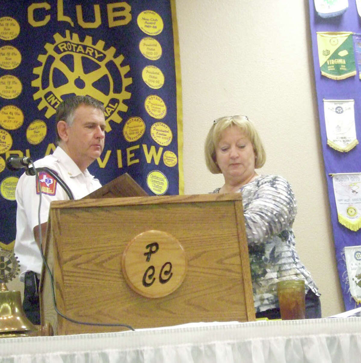 Jessica Thornton/Plainview HeraldFire Chief Rusty Powers accepts the Citizenship Award from Plain view Rotary Club President Coralyn Dillard Tuesday during the club meeting. The club recognized Plainview’s First Responders.