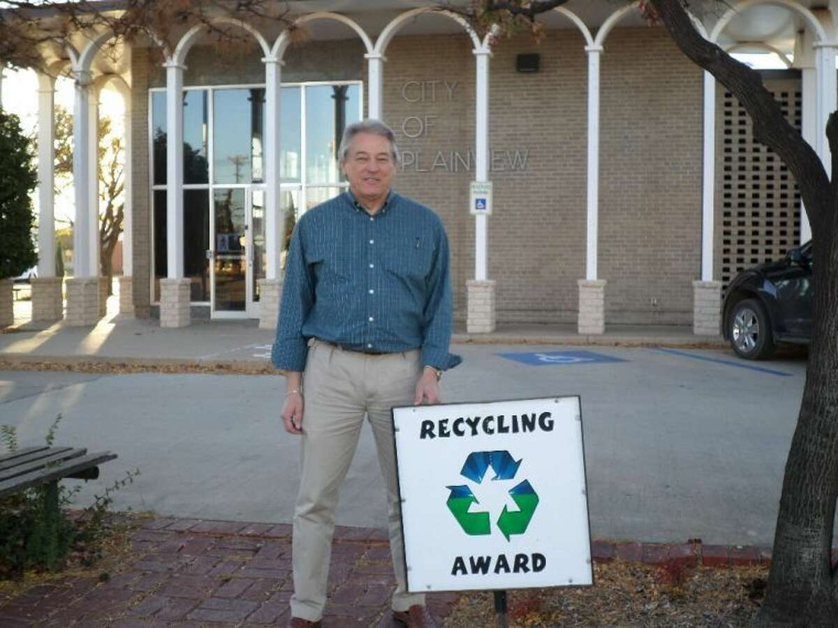 Courtesy PhotoPlainview City Manager Greg Ingham displays the Recycling Award that will be displayed outside Plainview City Hall throughout the month in recognition from the Keep Plainview Beautiful Committee for the city’s recycling efforts.