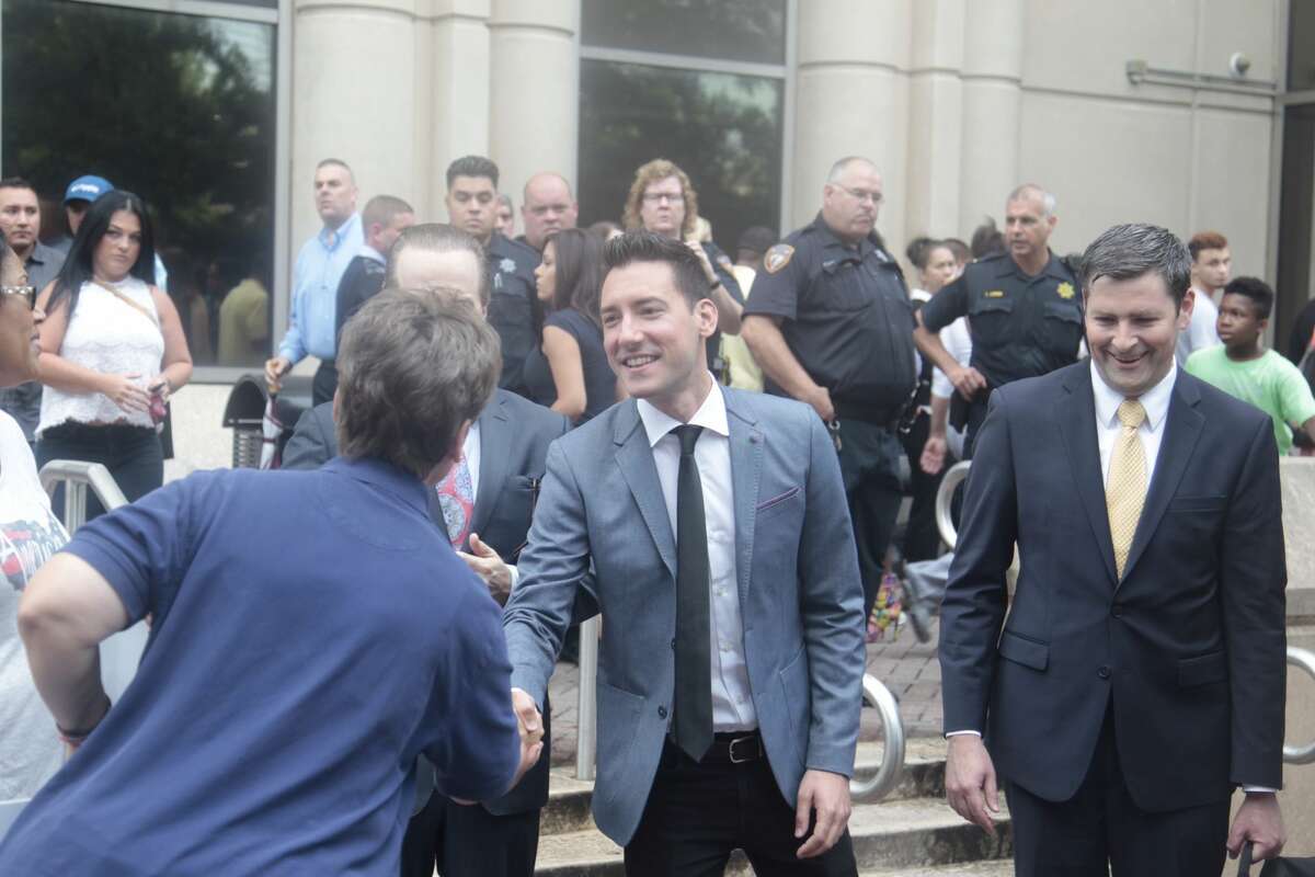 David Robert Daleiden is thanked by supports after the Harris County District Attorney's office on Tuesday dismissed all charges against anti-abortion activists who secretly videotaped Planned Parenthood officials in Houston.