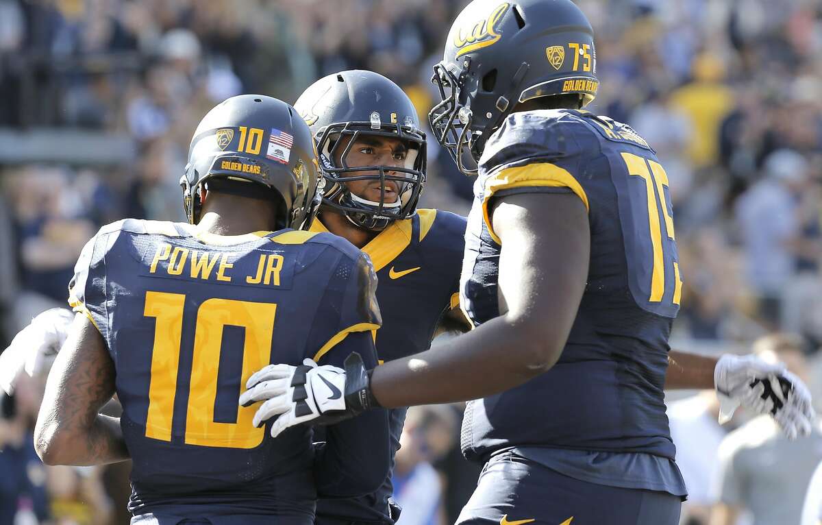 Cal's Kenny Lawler, 4 celebrates his 3rd quarter touchdown pass with teammates Darius Powe Jr, 10 and Aaron Cochran, 75 as the California Bears went on to beat the Washington State Cougars 34-28 at Memorial Stadium in Berkeley, Calif., on Sat. October 3, 2015.