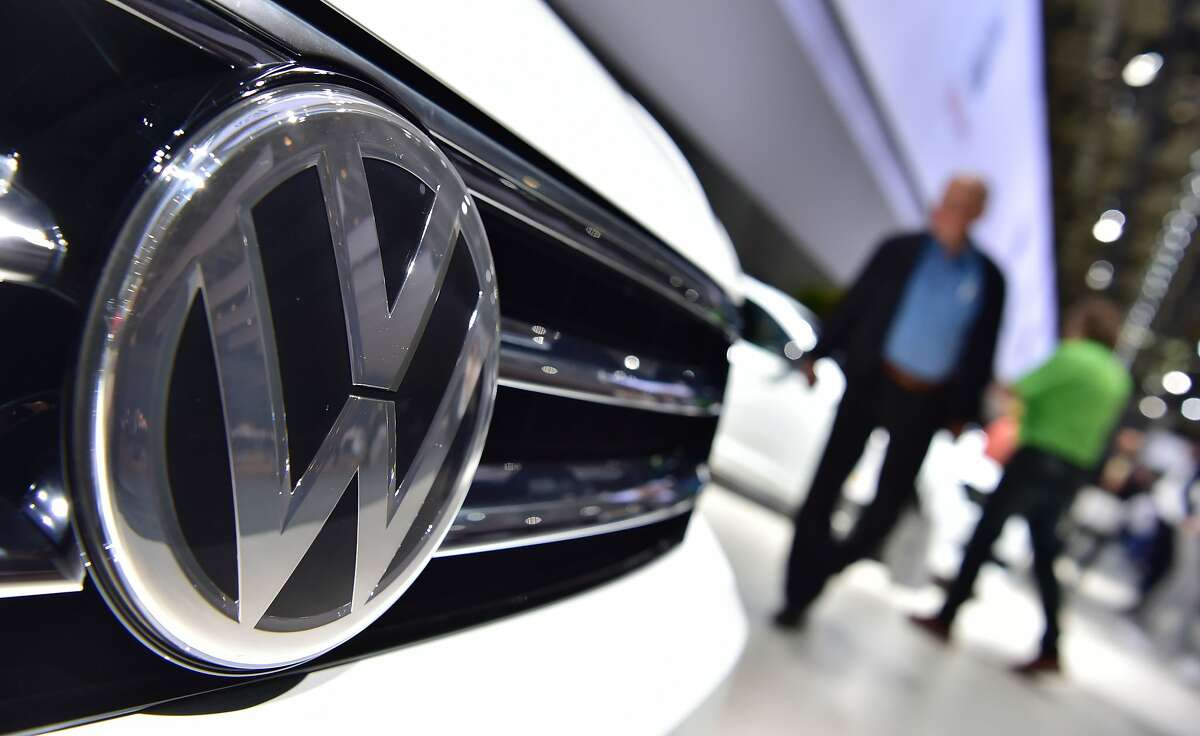 A VW Tiguan is on display during German carmaker Volkswagen shareholders' annual general meeting in Hanover. A federal judge in California granted preliminary approval to a $14.7 billion settlement over Volkswagen's emissions cheating scandal.
