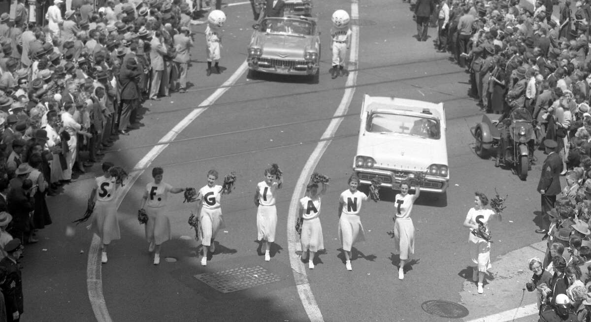 April 14, 1958: Cheerleaders walk down Market Street during the San Francisco Giants welcome parade.