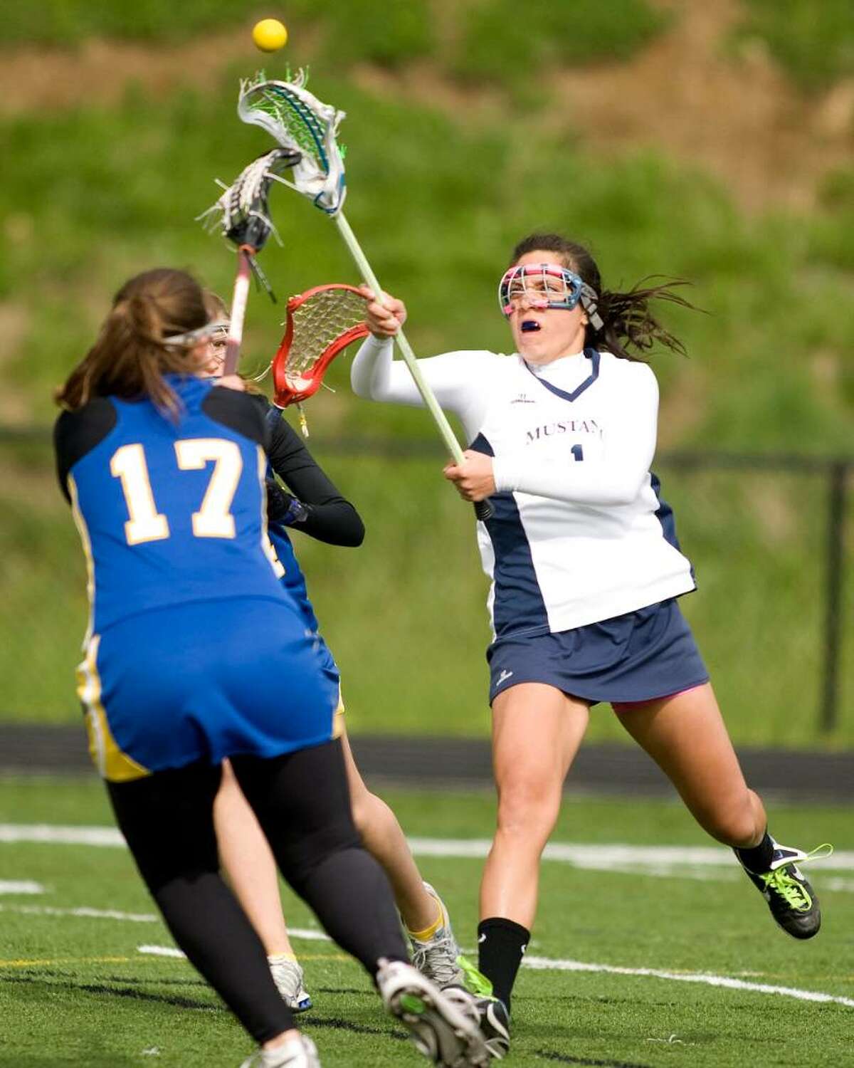 Immaculate's Makela Stankey, right, scores on a shot over Brookfield defender Jen Eagan Wednesday at Immaculate High.