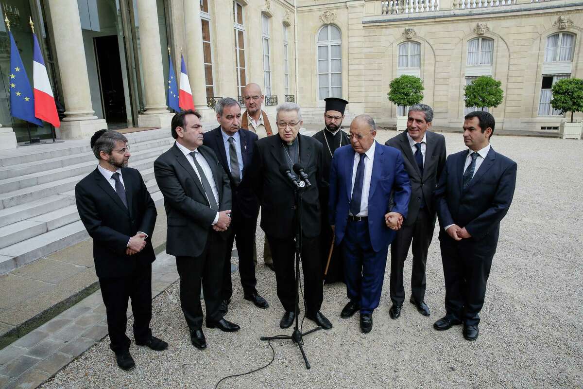 From left to right : France's Chief Rabbi Haim Korsia, French Jewish central Consistory President, Joel Mergui, President of Protestant Federation of France, Pastor Francois Clavairoly, President of the French Buddhist Union, Olivier Reigen Wang-Genh, French Cardinal, Andre Vingt-Trois, General Vicar of the Greek Orthodox metropolis, Grigorios Ioannidis, rector of the Great Mosque of Paris, Dalil Boubakeur, Boubakeur's aid and the vice-president of the French Council of The Muslim Faith, Ahmet Ogras, adresss the media after a meeting with French President, Francois Hollande, following yesterday attack at a church in Normandy, Wednesday, July 27, 2016. The Islamic State group crossed a new threshold Tuesday in its war against the West, as two of its followers targeted a church in Normandy, slitting the throat of an elderly priest celebrating Mass and using hostages as human shields before being shot by police. (AP Photo/Thomas Padilla)