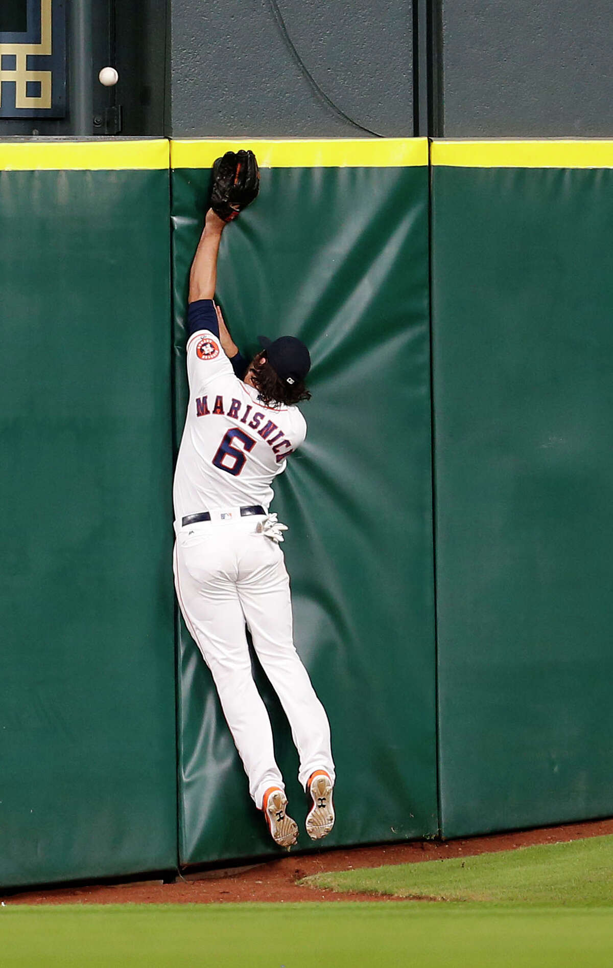 Center fielder Jake Marisnick makes a valiant effort to prevent the only run allowed by Lance McCullers but can't catch a homer by the Yankees' Brian McCann.