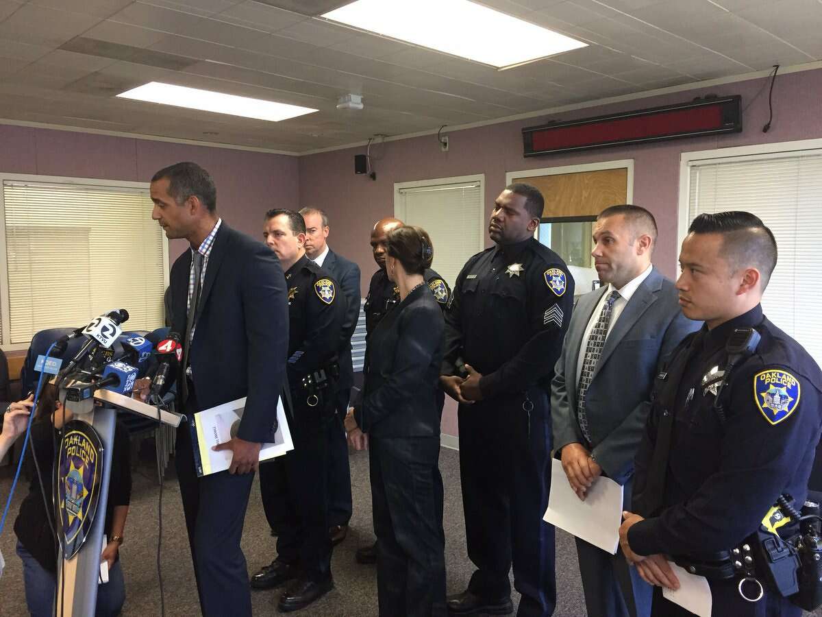 Lt. Roland Holmgren head of Oakland Police homicide unit, briefs reporters Thursday morning on the arrest of a man accused of shooting at an Oakland Police sergeant.