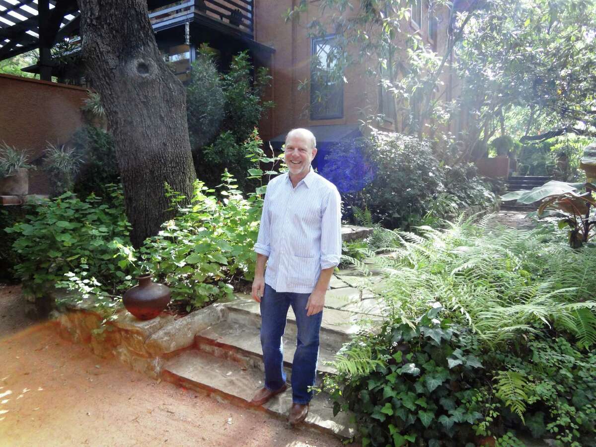 Ted Flato of Lake | Flato Architects stands in the garden outside his 1909 Alamo Heights home, designed by San Antonio architect Harvey Page, whose other buildings include Clara Driscoll's Laguna Gloria in Austin.