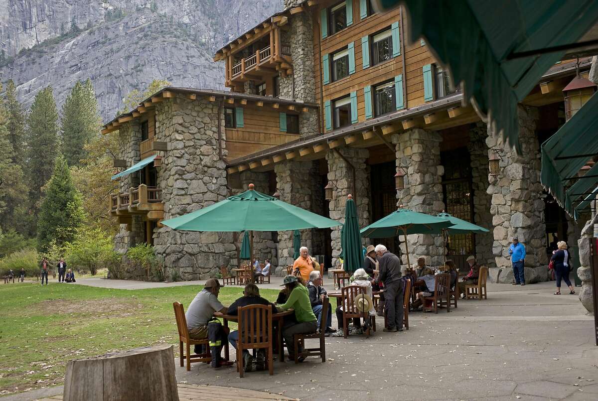 In this Oct. 24, 2015 file photo, people dine outside the Ahwahnee hotel in Yosemite National Park, Calif.
