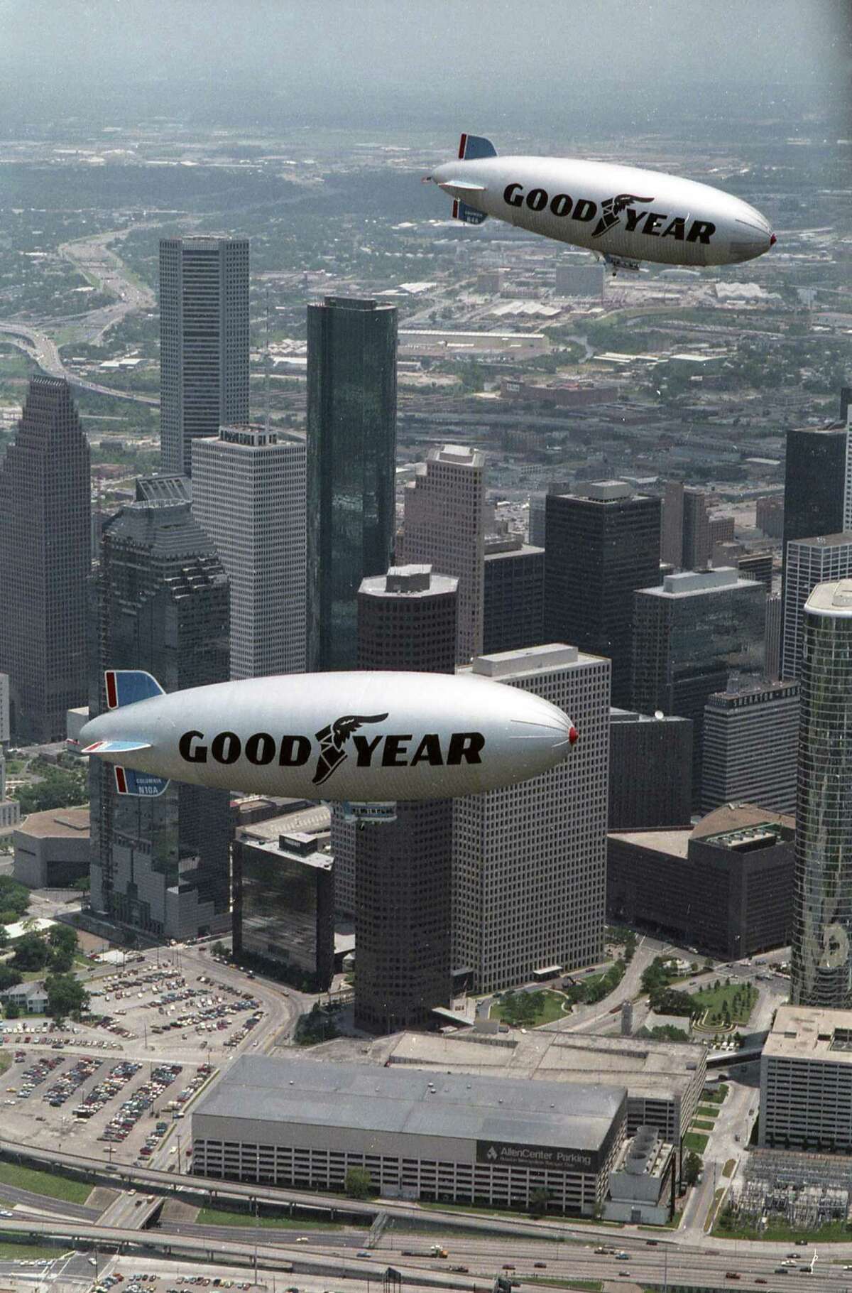 The Goodyear blimp Columbia takes a tour of Houston with its replacement, also named Columbia, July 1, 1986.