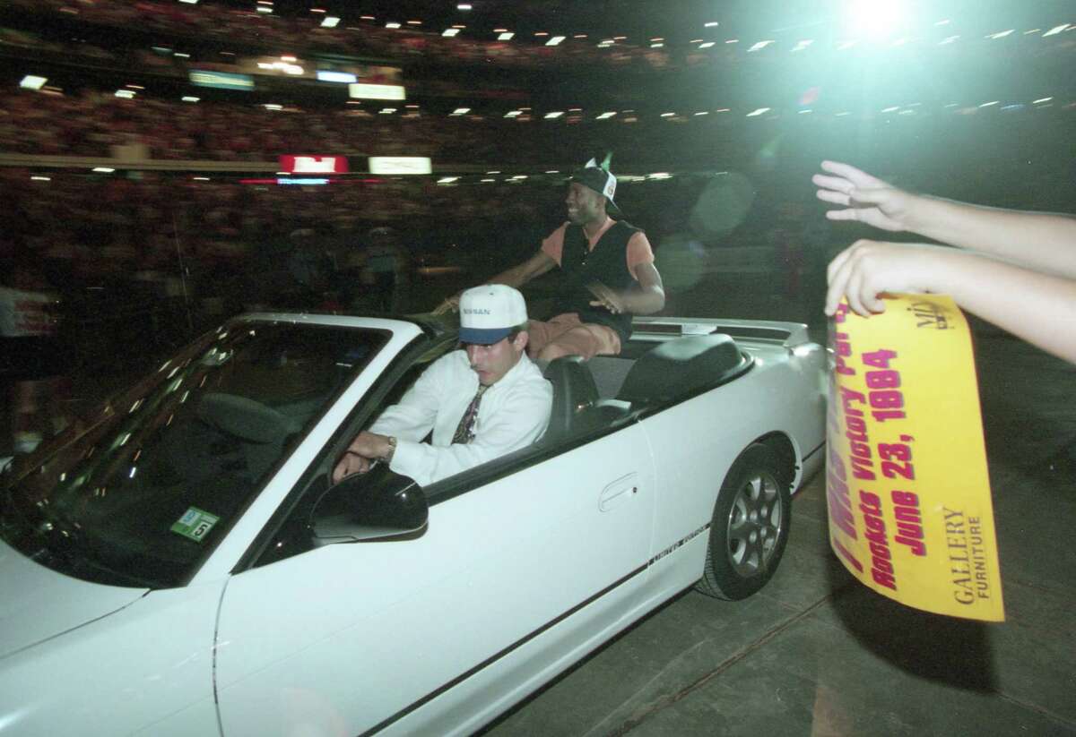 06/23/1994 - Houston Rockets at their sold-out victory party in the Astrodome Thursday night, June 23, 1994. Nearly 52,000 roaring fans celebrated the Houston Rockets' victory over the New York Knicks for the National Basketball Association championship. Rockets Kenny Smith greets fans as he is driven into the dome. Â Houston Chronicle