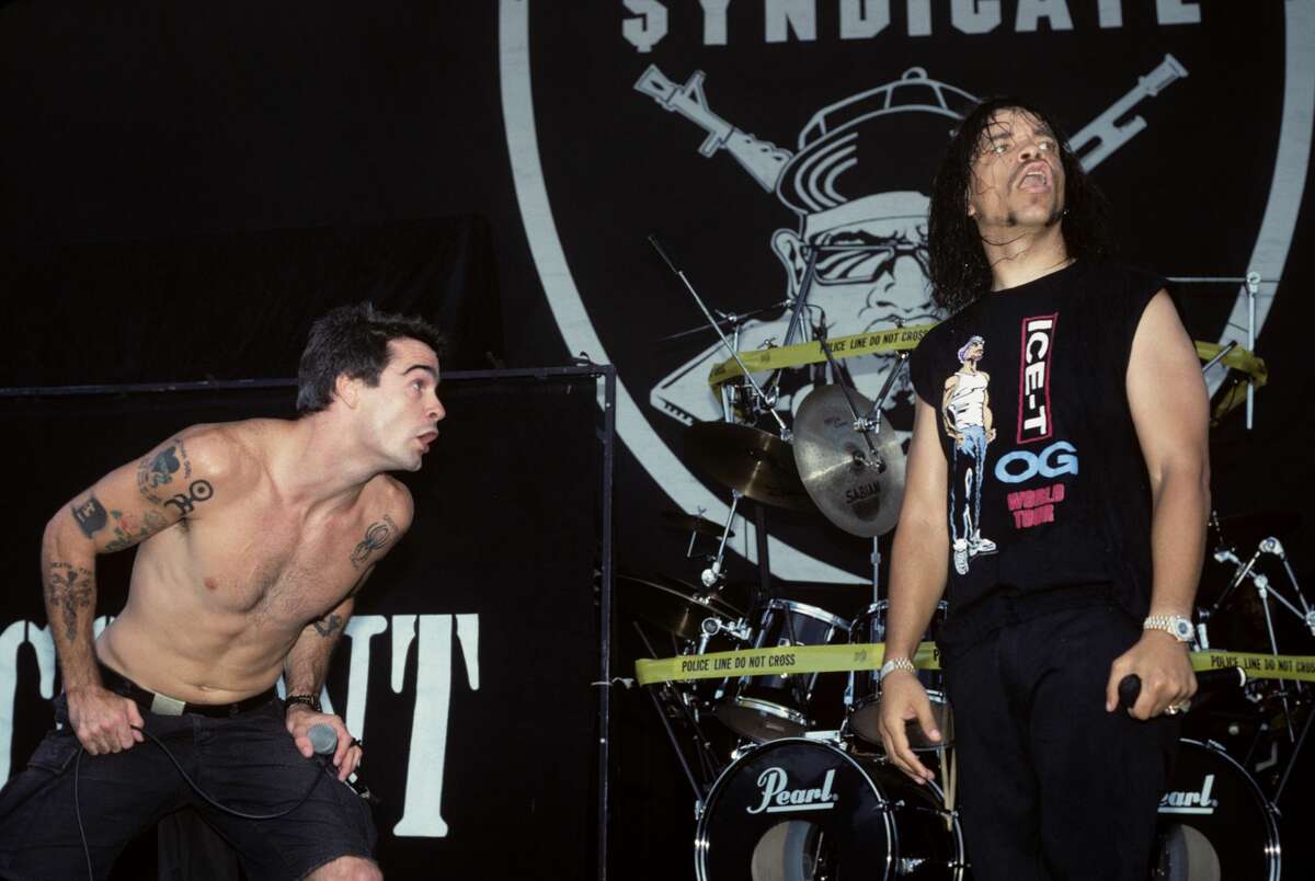 Henry Rollins and Ice-T performing on stage.