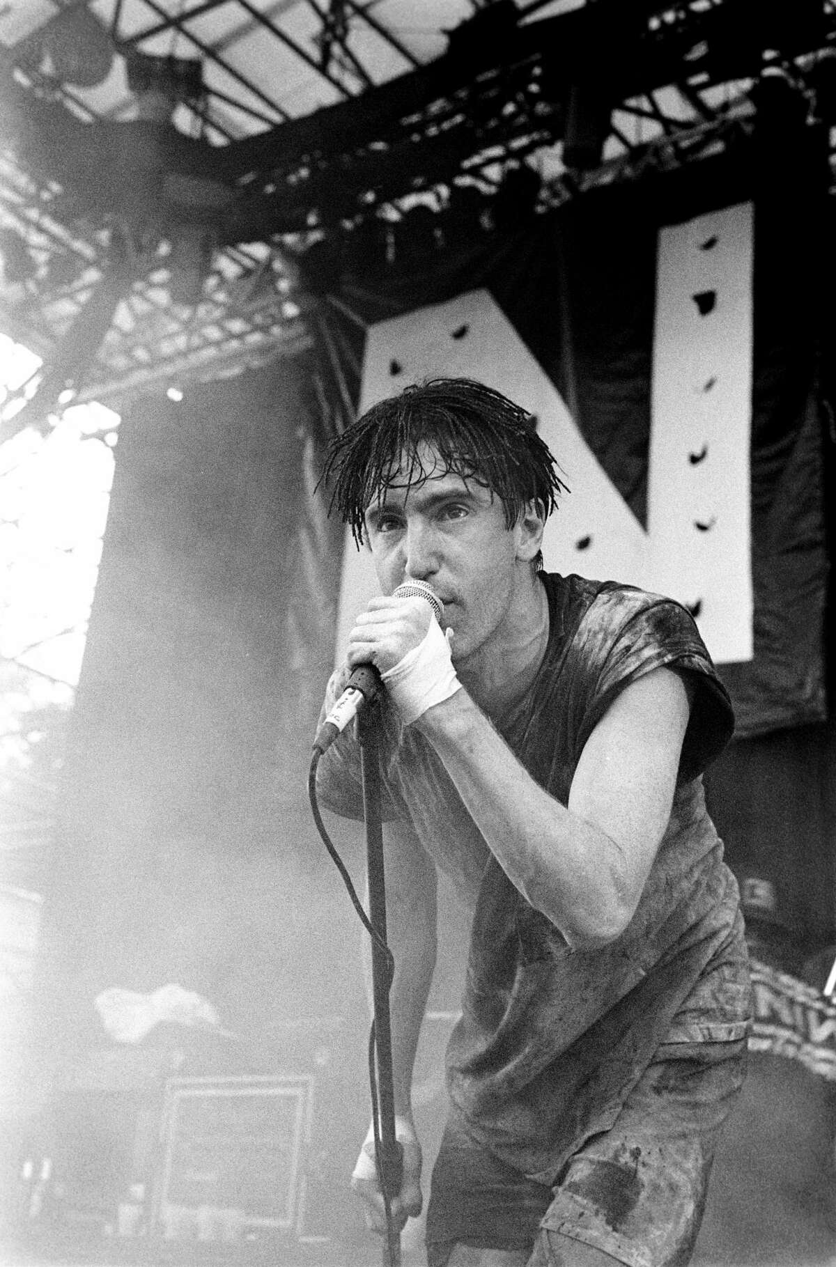 Trent Reznor performing with Nine Inch Nails at Lollapalooza in Waterloo, New Jersey on August 14, 1991. (Photo by Ebet Roberts/Redferns)