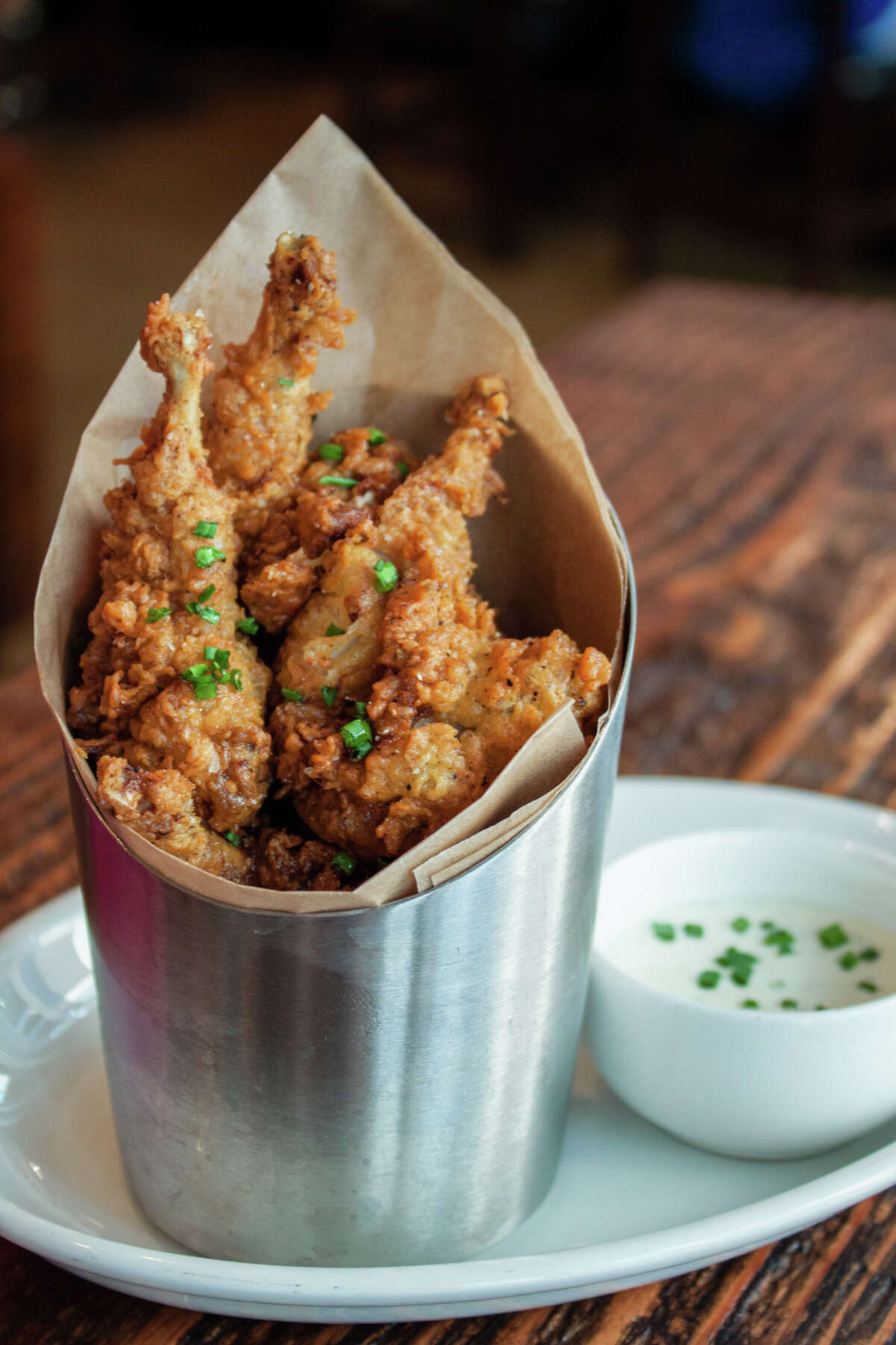 Bowl & Barrel, a bowling and dining experience, is opening at CityCentre, Houston, on Aug. 8. Shown: Hot fried quail.