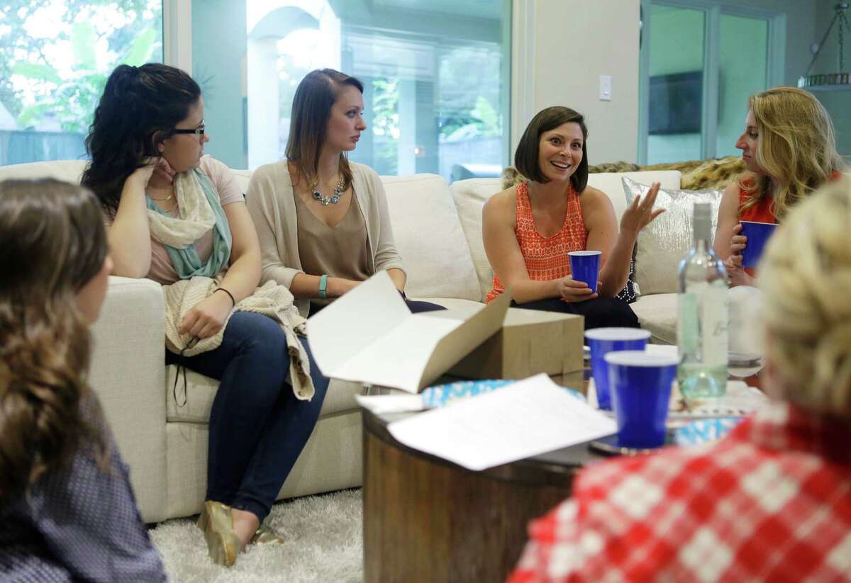 Kim Hojnacki (in orange) talks with her book club, Wednesday, June 22, 2016, in Houston. The friends met through Bumble BFF, a service for finding platonic friendships within the dating app Bumble. The company is also helping women access venture capital through Bumble Fund. ( Mark Mulligan / Houston Chronicle )