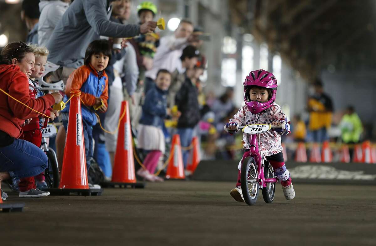 Miku Shiozawa of Japan, in one of her final heats and went on to win the 2-year-old division during the Strider Cup World Championship bicycle race at Pier 35 along the Embarcadero in San Francisco, California, on Sat. July 30, 2016.