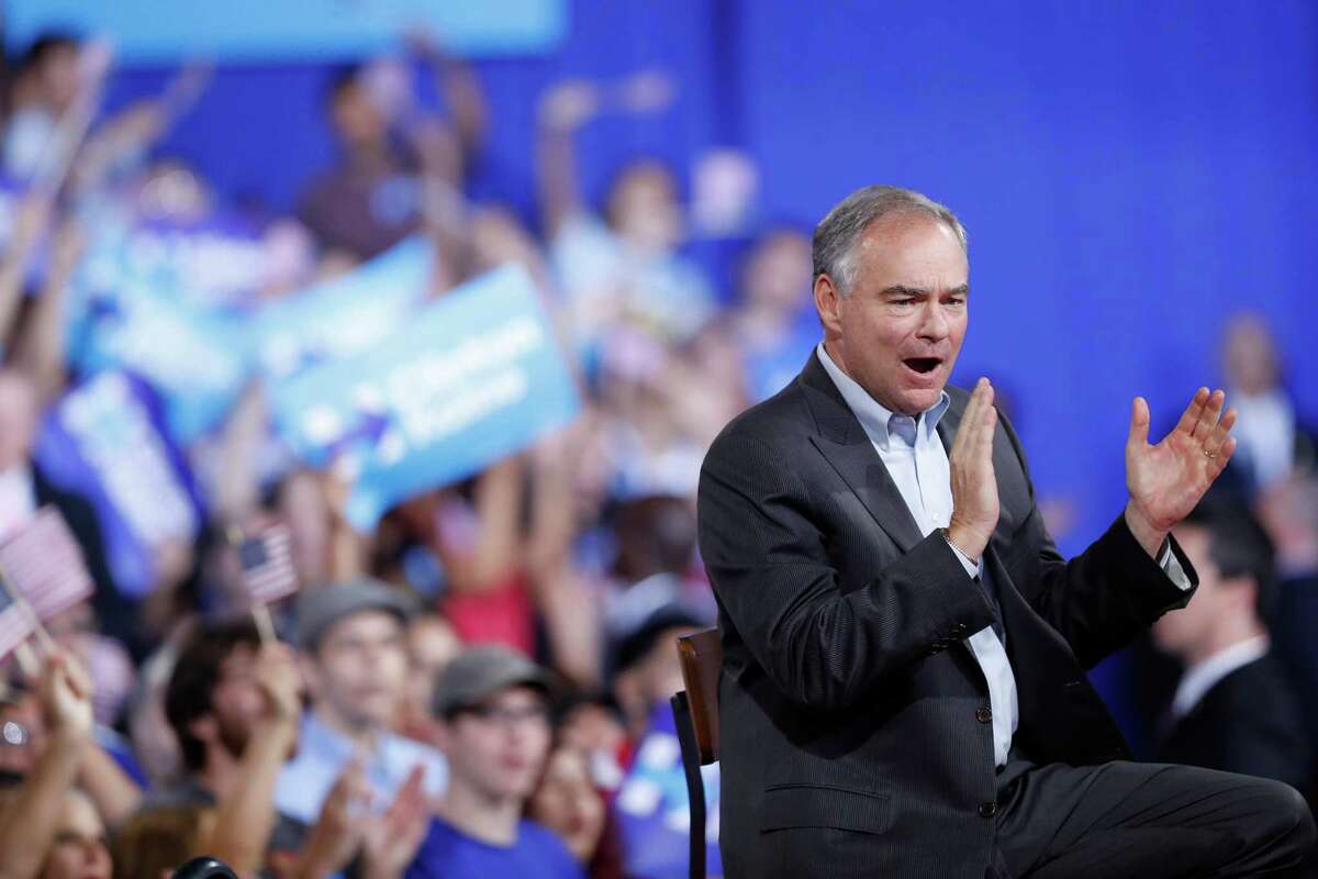 Sen. Tim Kaine, D-Va., claps as Democratic presidential candidate Hillary Clinton speaks during a campaign rally at Florida International University Panther Arena in Miami, Saturday, July 23, 2016. Clinton has chosen Kaine to be her running mate. (AP Photo/Mary Altaffer)