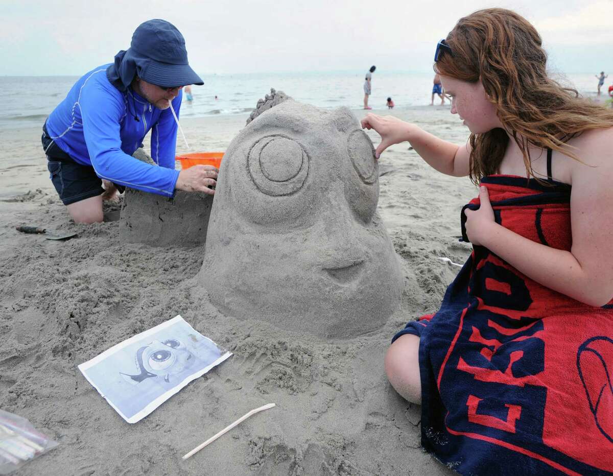 Darrell DeMakes of Riverside works on Dorie with the help of his 12-year-old daughter Demi DeMakes during the annual Sandblast! sand sculpture competition sponsored by the Greenwich Arts Council and the Town of Greenwich Department of Parks and Recreation at Greenwich Point, Conn., Saturday, July 30, 2016.