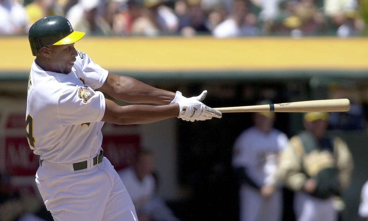 Oakland Athletics' Jermaine Dye connects for a solo home run off Kansas City Royals starting pitcher Kris Wilson during the second inning in Oakland, Calif., Sunday, July 29, 2001. The Athletics general manager Billy Beane reveled: Rather than shipping off Jason Giambi, as many expected, he brought home Jermaine Dye. And with the deal, leisurely sealed a week before the trade deadline scramble, Beane made a statement: The A's are going for it.