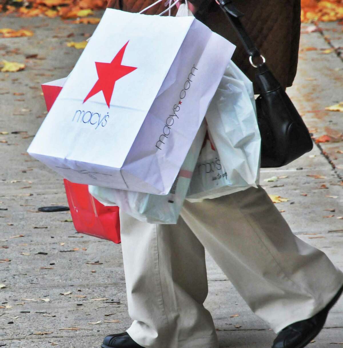 A pedestrian carries a Marshalls Plc shopping bag in San Francisco