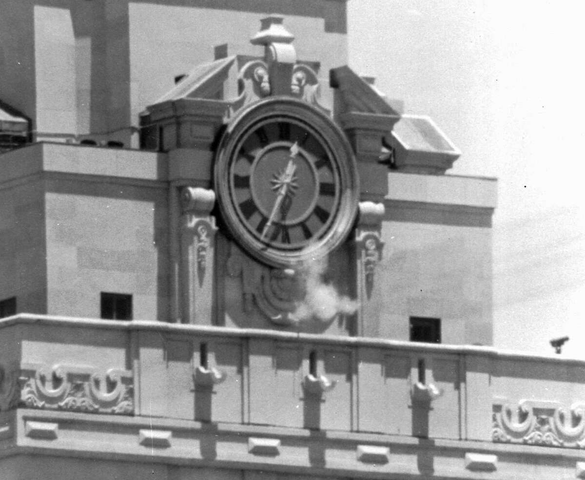 Smoke rises from sniper Charles Whitman's gun on Aug. 1, 1966, as he fires from the tower of the University of Texas administration building, killing 16 people and wounding 31 in his 96-minute massacre.