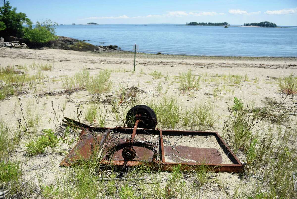 Farm equipment dating back to when Calf Island was used as breeding ground for cows sits on the beach of the island in the waters of the Long Island Sound off the coast of Greenwich, Conn. Wednesday, July 27, 2016. Calf Island is Greenwich's largest offshore island, 31.5 acres, and is located about 3,000 feet south of Byram Harbor. Calf Island is one of the islands owned by the Stewart B. McKinney National Wildlife Refuge and boasts a diverse ecosystem including tidal wetlands, flats, rocky shore, sandy beach and mixed forest that provides an excellent bird habitat.