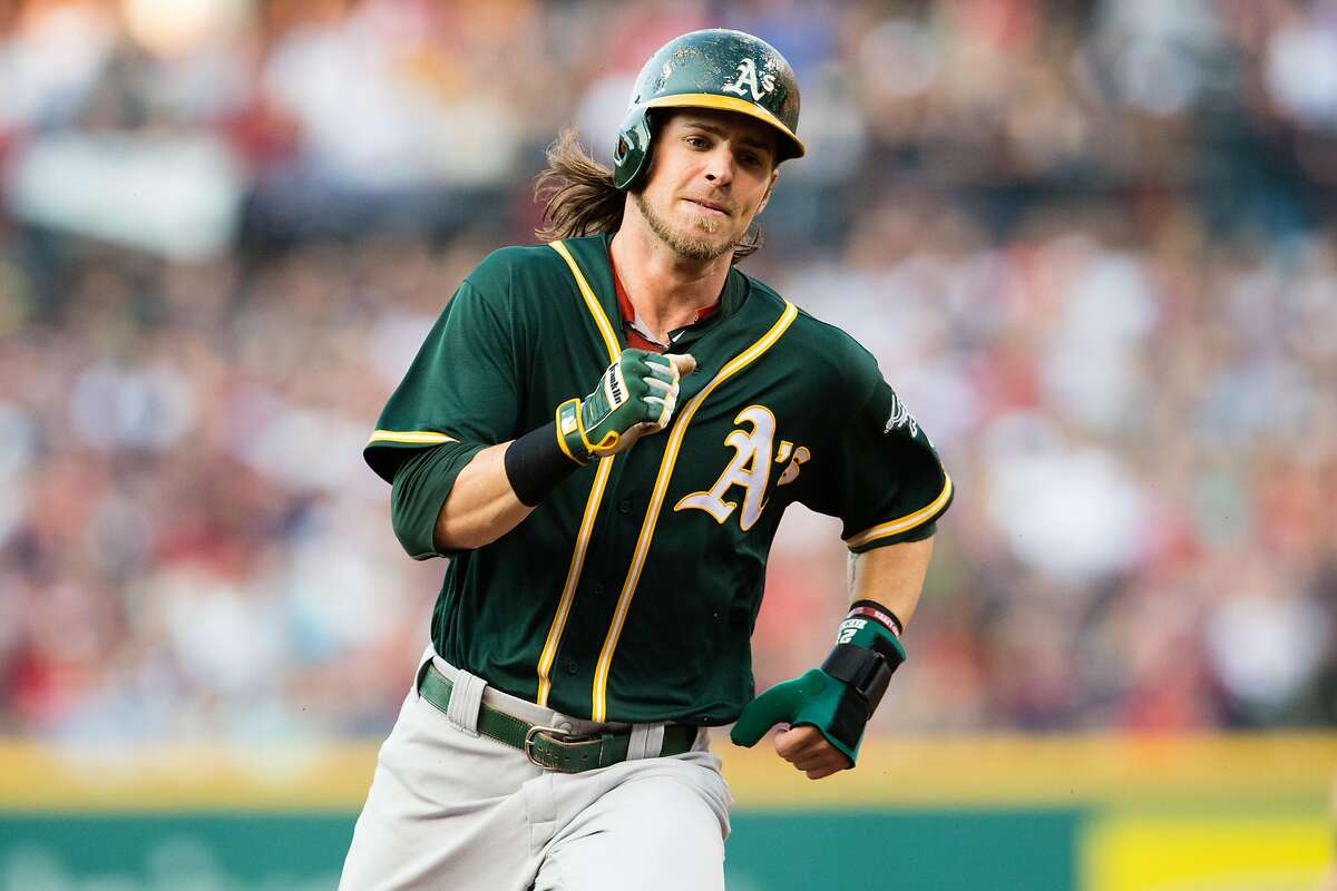 CLEVELAND, OH - JULY 30: Josh Reddick #22 of the Oakland Athletics rounds second on his way to third off a hit by Danny Valencia #26 during the first inning against the Cleveland Indians at Progressive Field on July 30, 2016 in Cleveland, Ohio. (Photo by Jason Miller/Getty Images)