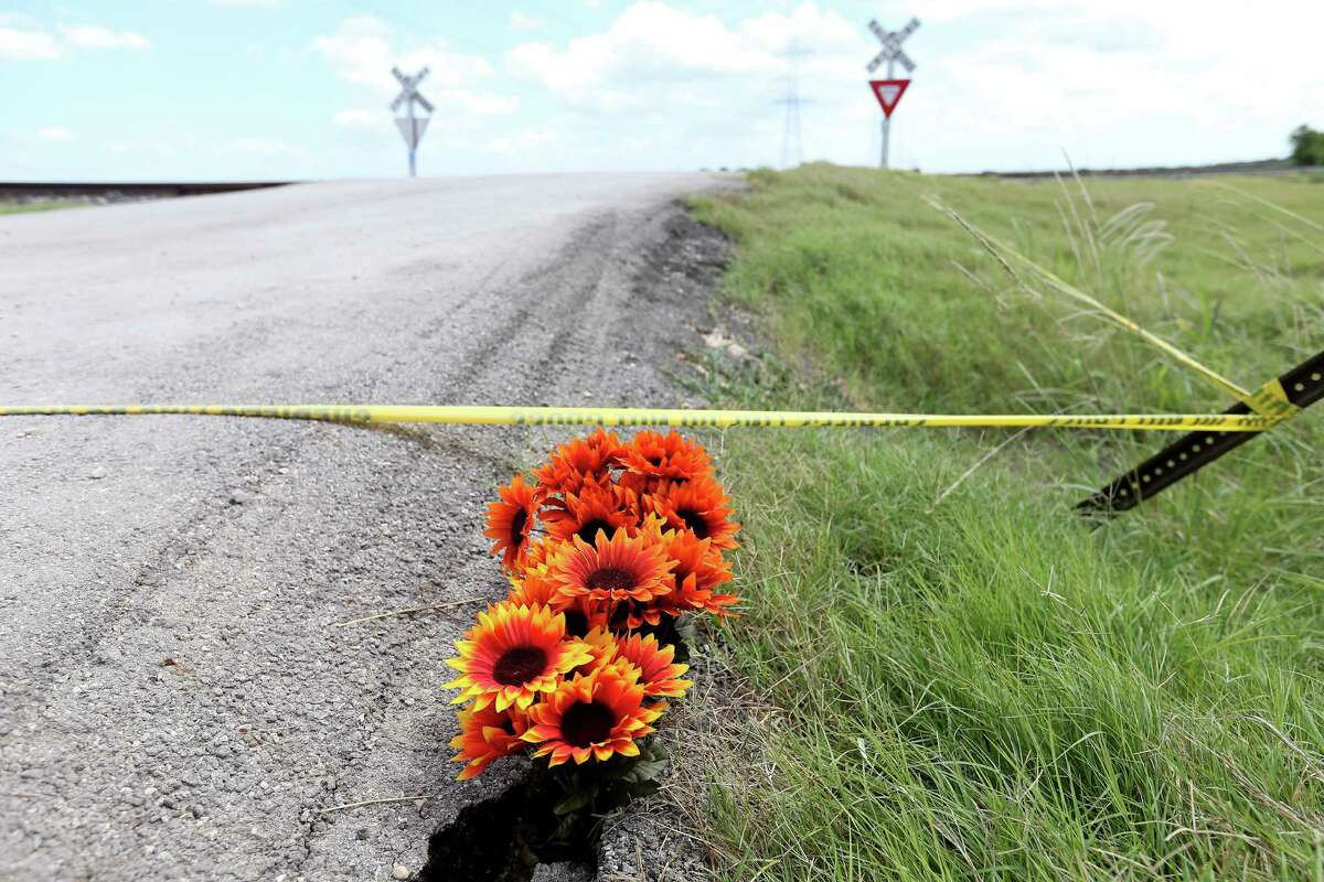 Flowers left by Kimberly Martinez, of Lockhart, Sunday July 31, 2016, near the scene of a hot air balloon crash that killed 16 people near Maxwell, Texas in Caldwell County.