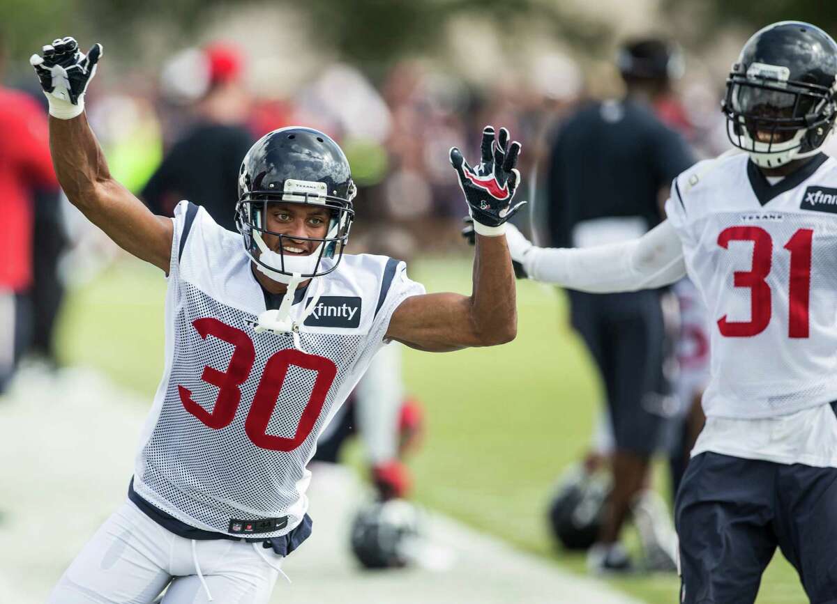 Houston Texans cornerback Kevin Johnson (30) and defensive back Charles James (31) run a special teams coverage drill during Texans training camp at Houston Methodist Training Center on Sunday, July 31, 2016, in Houston.