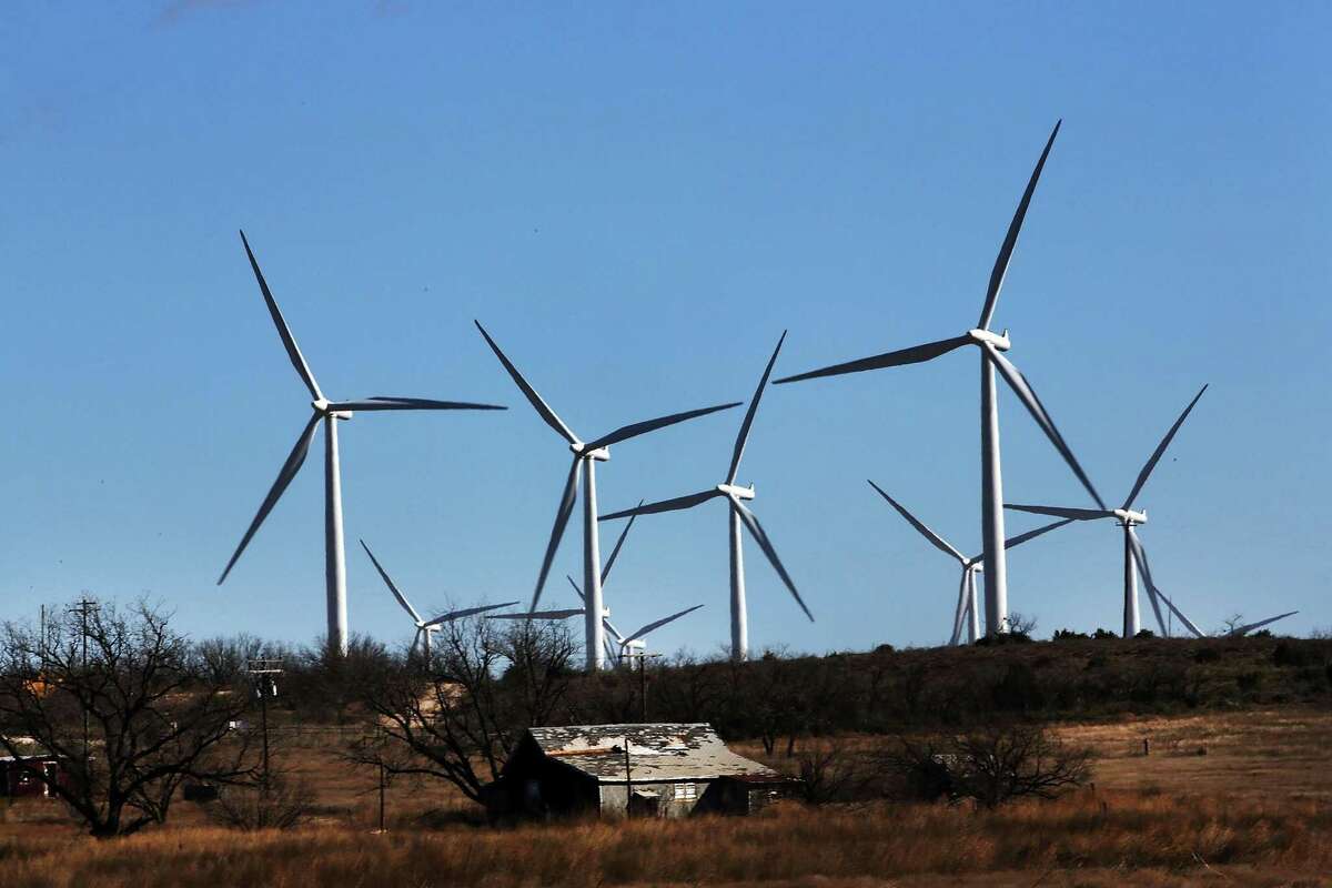 Wind turbines turn at a wind farm in Colorado City, Texas. There are perils in depending entirely on renewable energy sources.