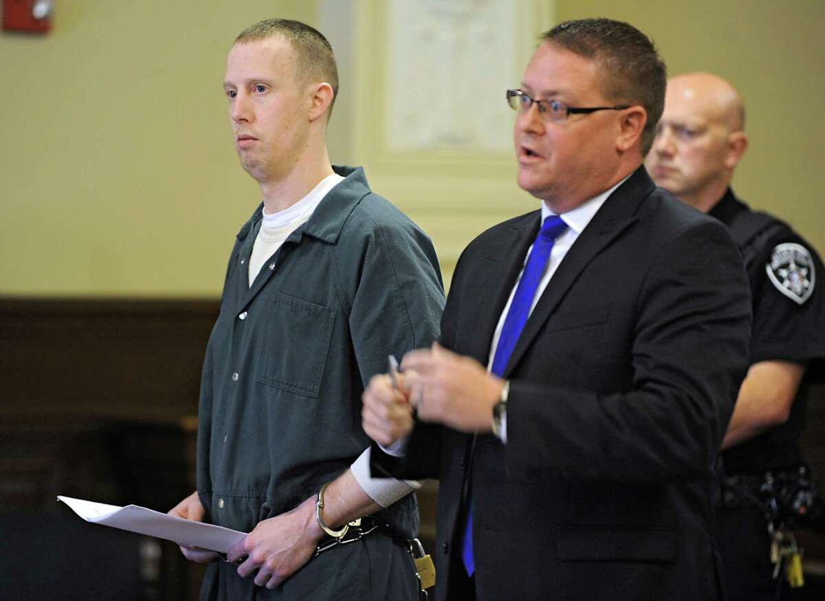 Jacob Heimroth stands with public conflict defender Joseph Ahearn in a courtroom at the Rensselaer County Courthouse for his arraignment on Thursday, Aug. 27, 2015 in Troy, N.Y. (Lori Van Buren / Times Union archive